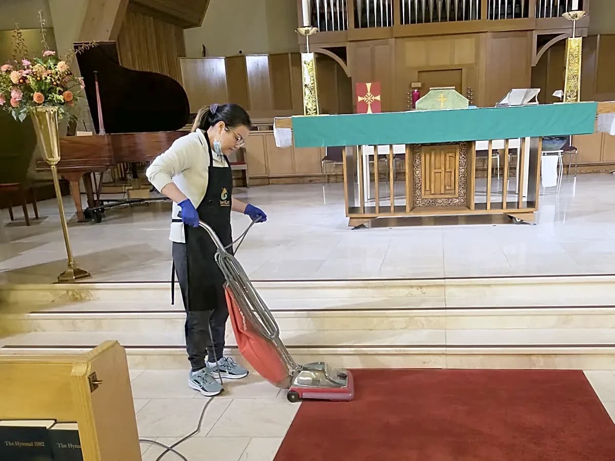 Janicat cleaner vacuuming a church sanctuary