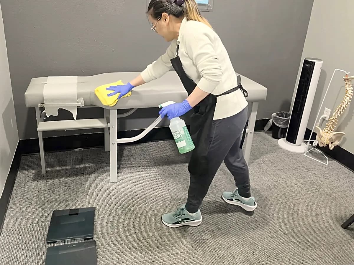 Janicat cleaner disinfecting an exam table
